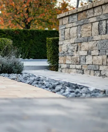A detail of stonework and planting